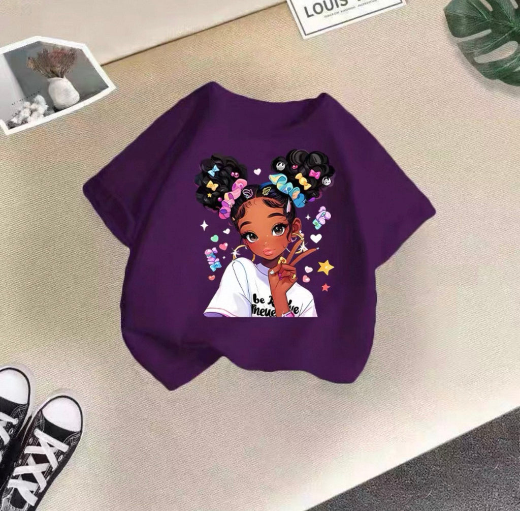 Purple sweatshirt with a graphic of a girl with styled hair on a beige surface.