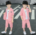 Two identical images of a child wearing a pink suit on a road.