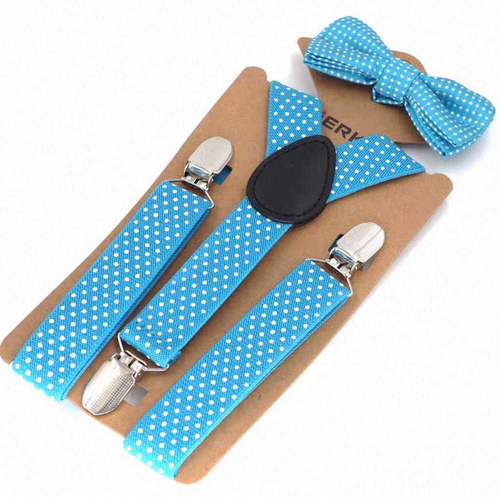 Blue polka dot suspenders and bow tie set on a cardboard backing