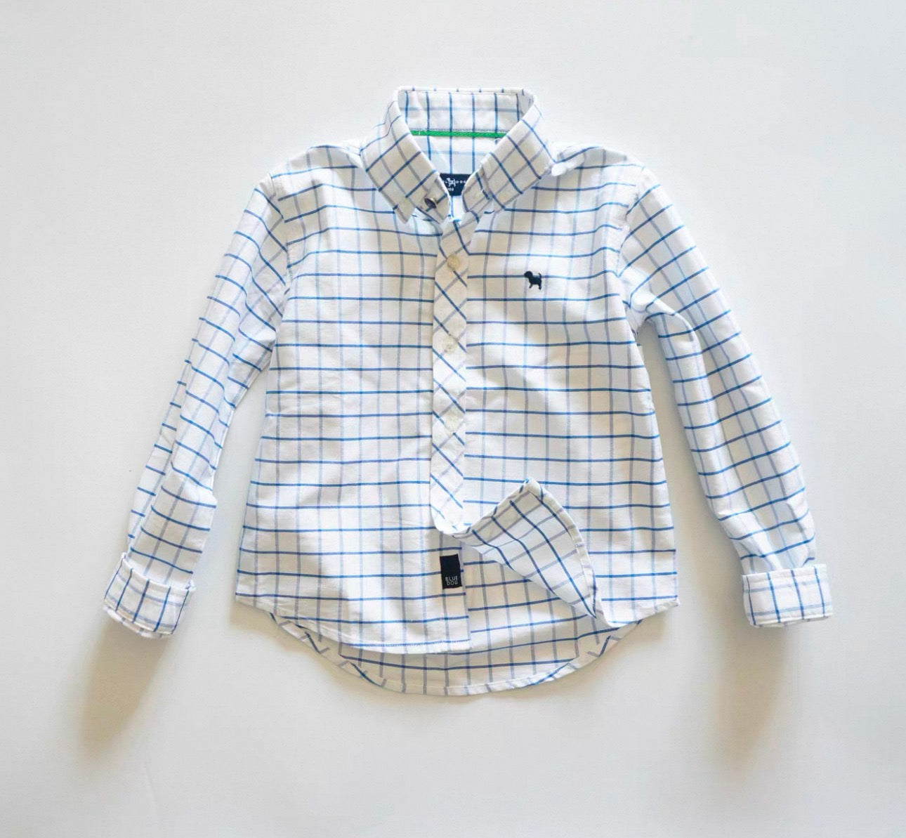 Plaid shirt with long sleeves on a light gray background