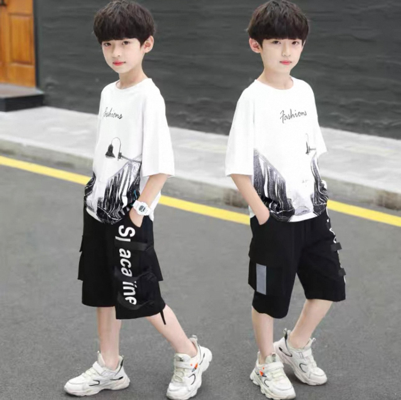 Two children wearing matching outfits with white t-shirts and black shorts on a street.