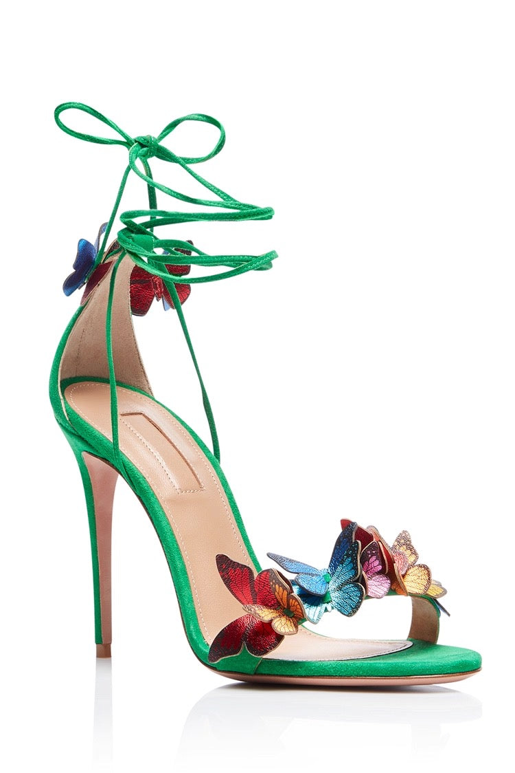 Green stiletto high heel sandal with ankle wrap straps and multicolored butterfly accents.