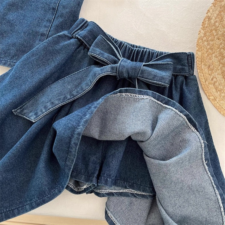 Denim skirt with a bow detail on a neutral background