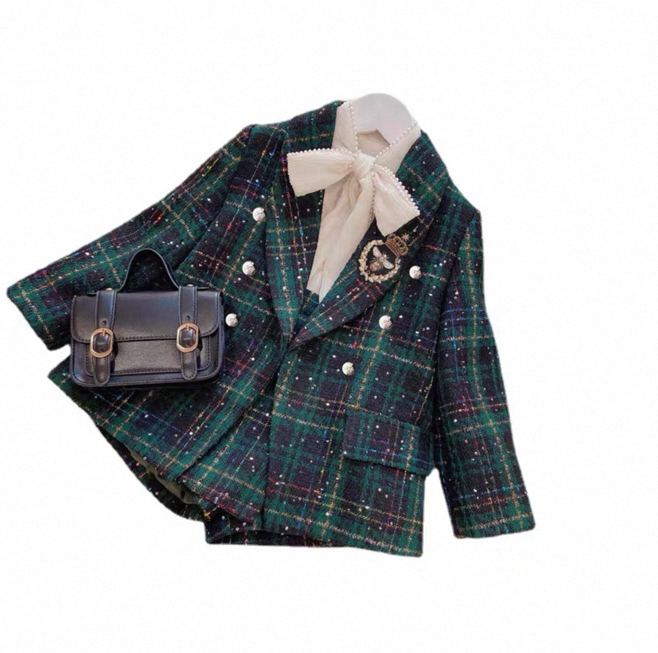Green plaid jacket with a white shirt and black handbag on a white background
