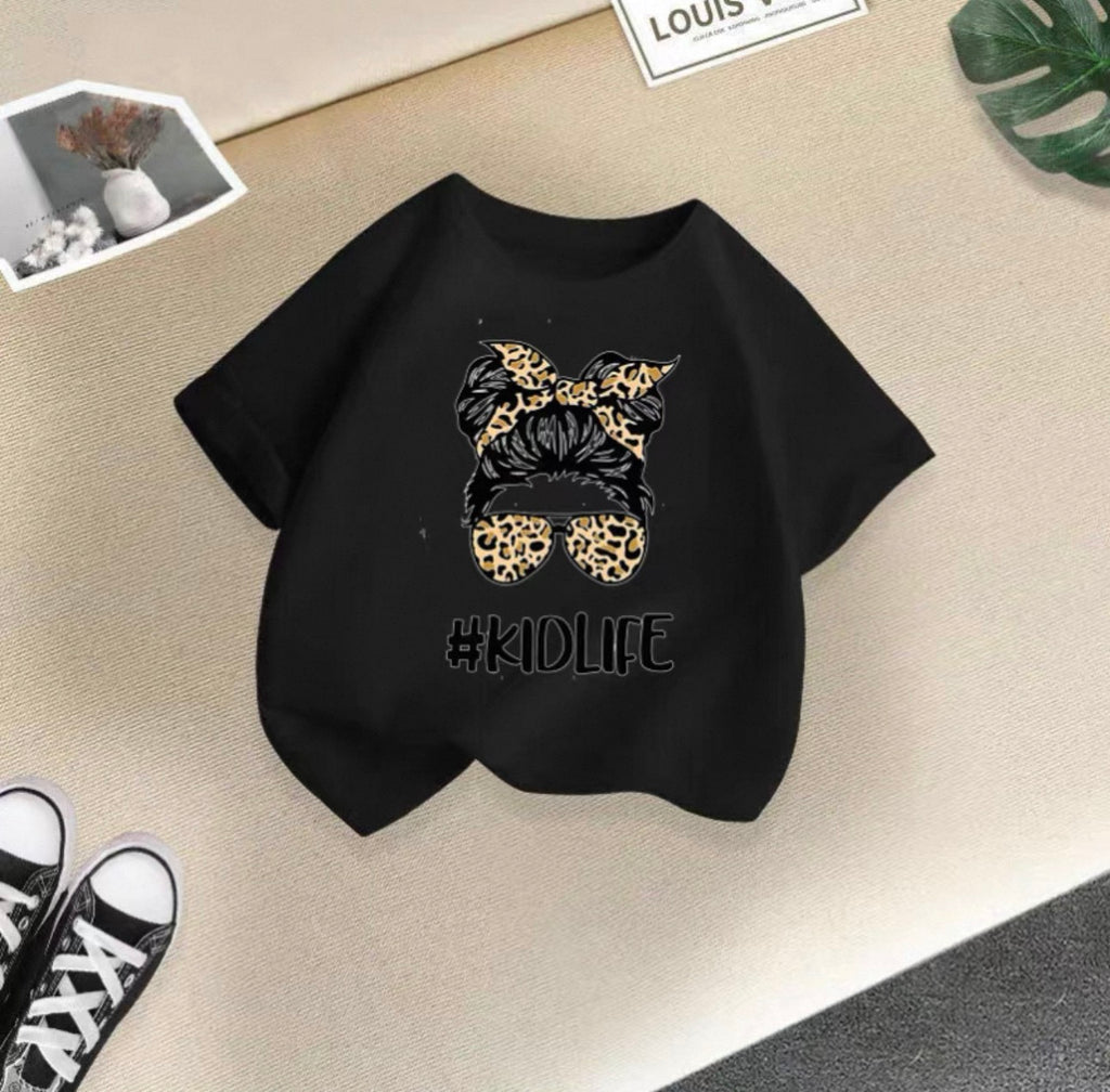 Black sweatshirt with leopard print design and '#KIDLIFE' text on a beige surface.