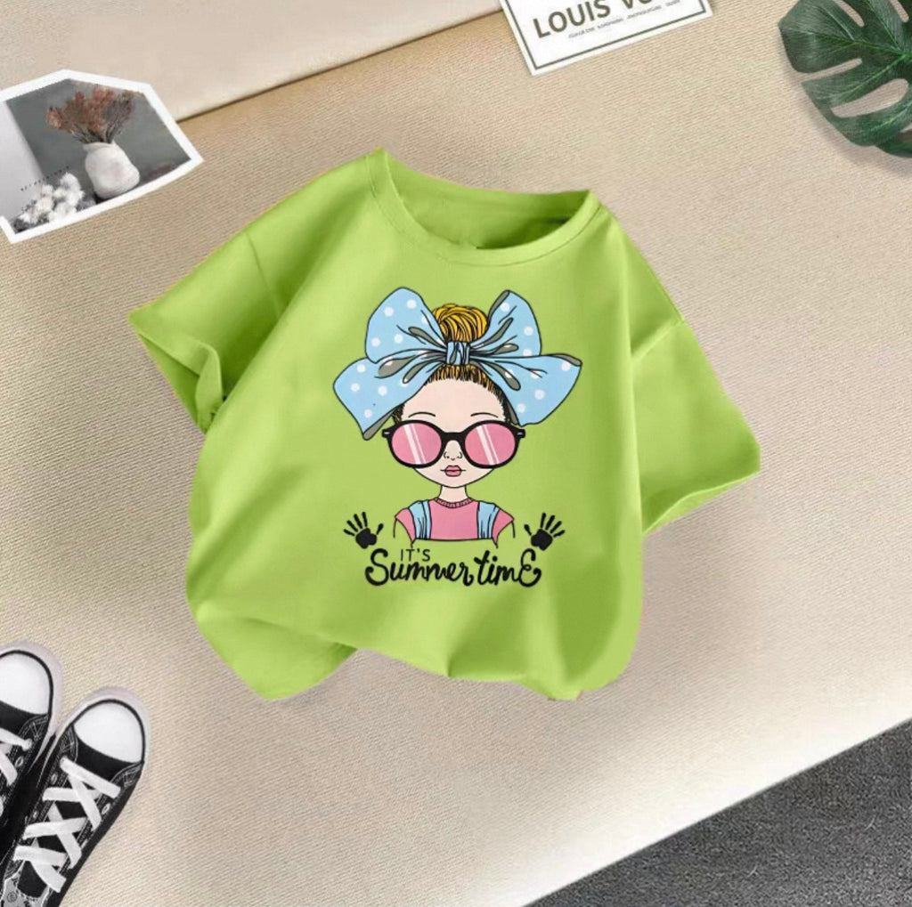 Green sweatshirt with a cartoon design and 'It's Summertime' text on a beige surface.