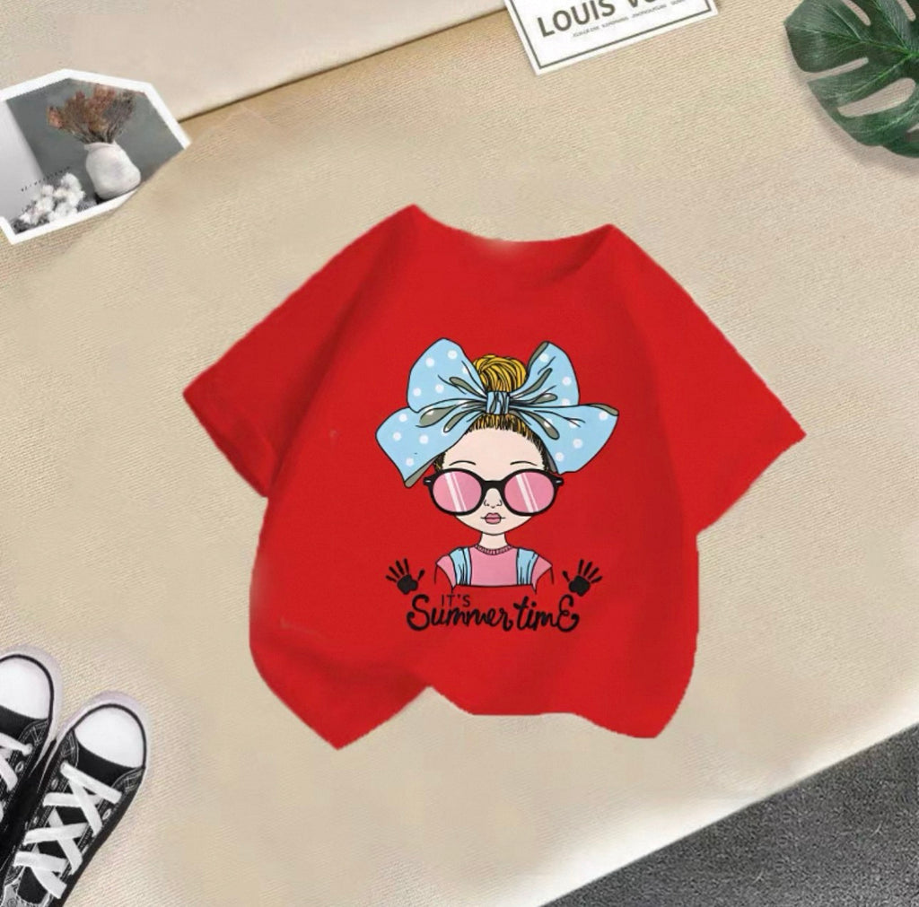 Red t-shirt with a cartoon design and 'It's Summertime' text on a beige surface.