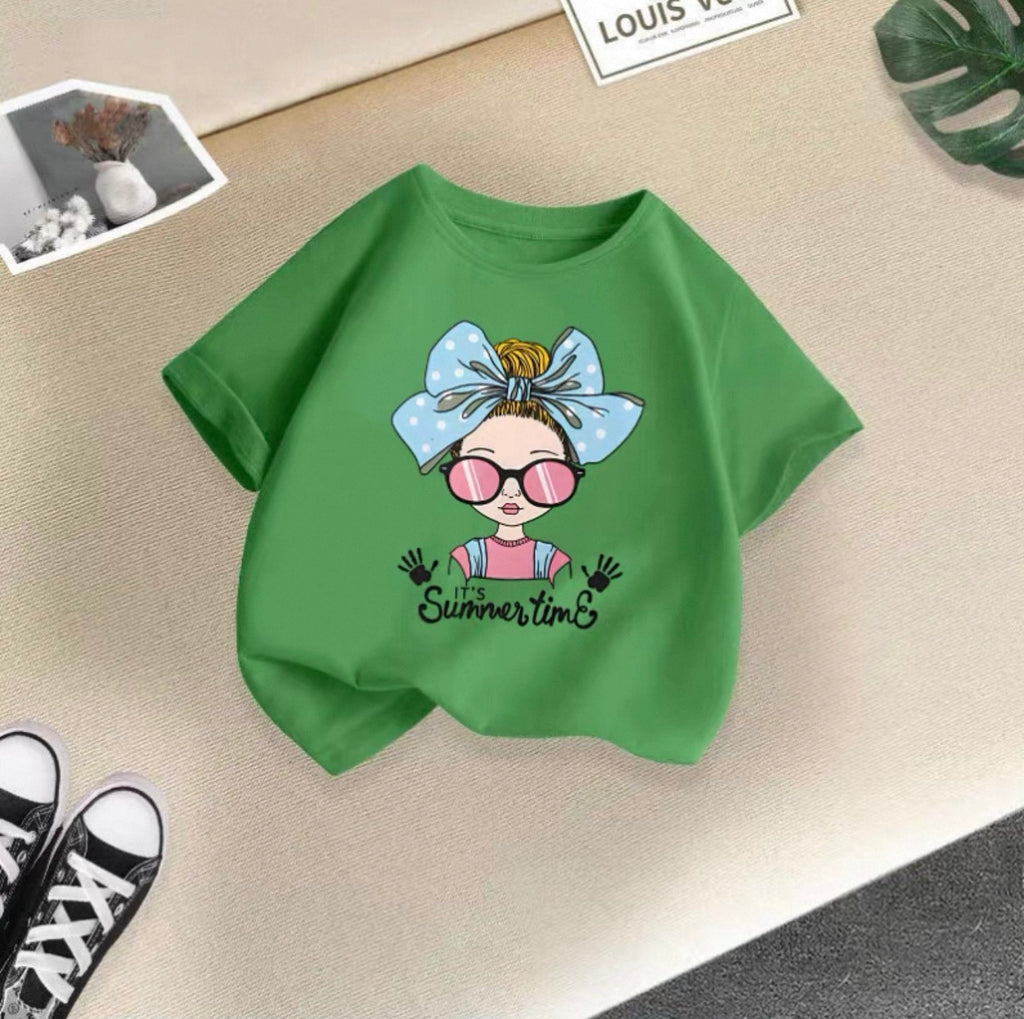 Green t-shirt with a graphic design on a beige surface