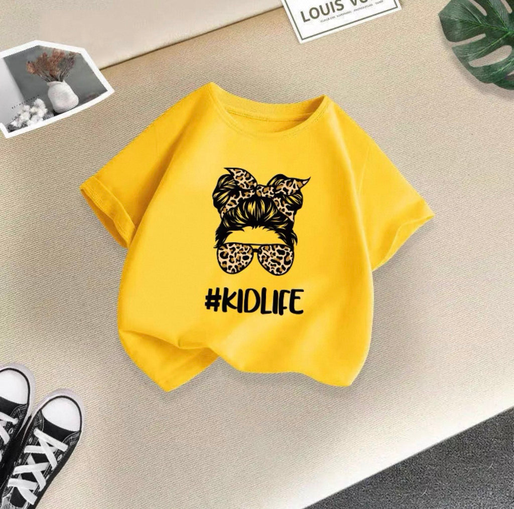 Yellow sweatshirt with '#KIDLIFE' design on a light surface