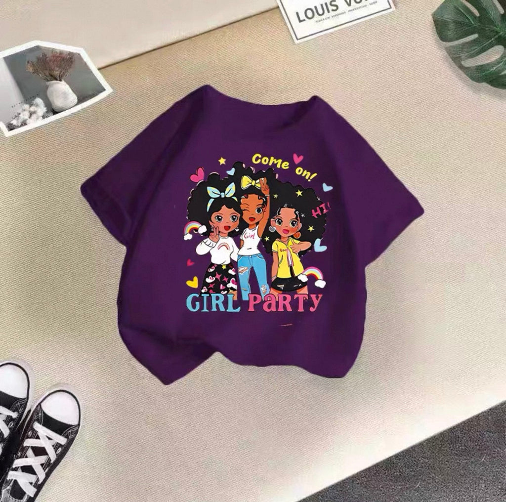 Purple sweatshirt with cartoon characters and text on a beige surface