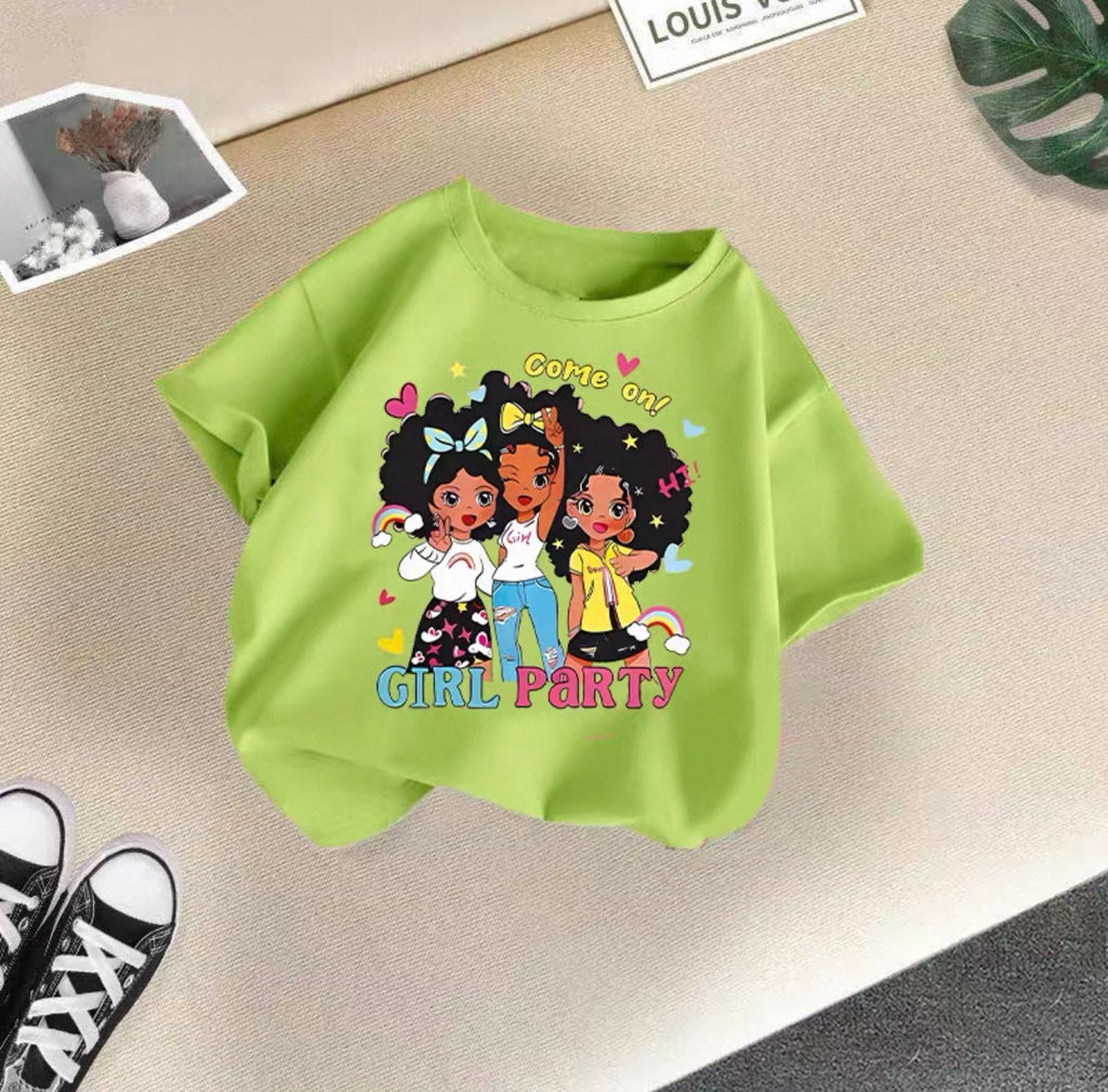 Green t-shirt with cartoon girls and 'Girl Party' text on a beige surface.