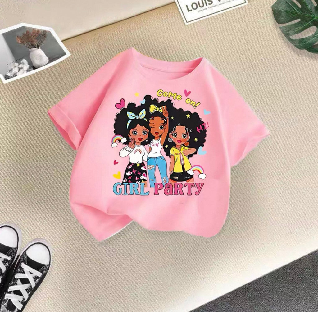 Pink t-shirt with cartoon girls and 'Girl Party' text on a beige surface.