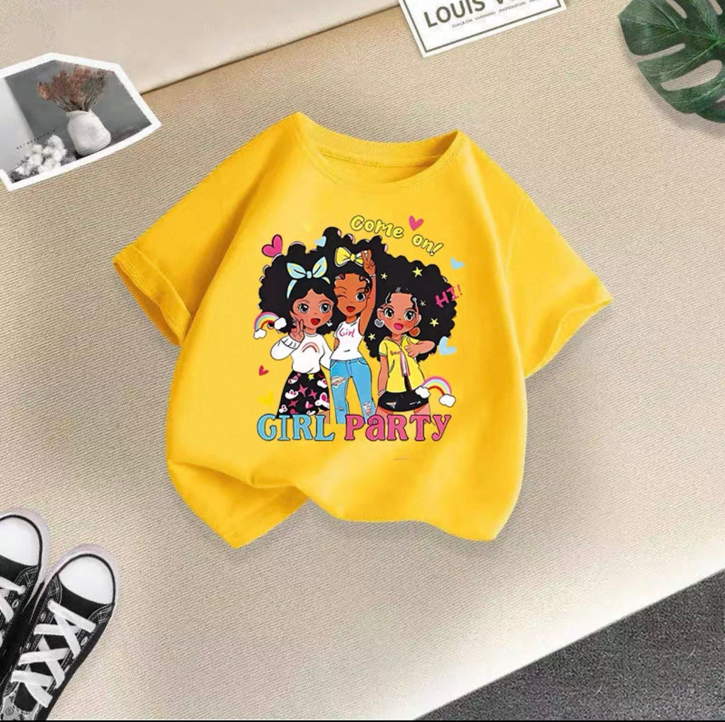 Yellow sweatshirt with cartoon girls and 'Girl Party' text on a textured surface.