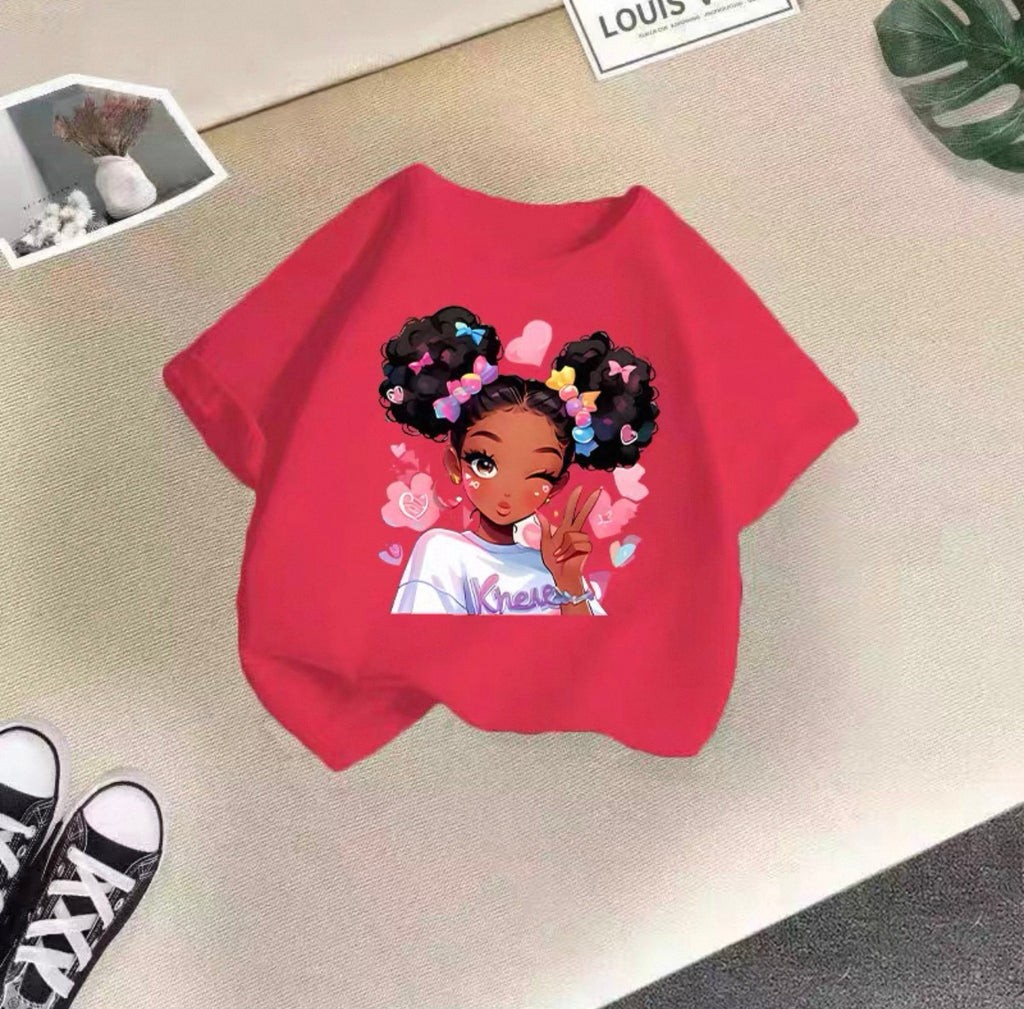 Red sweatshirt with a graphic of a girl with colorful hair on a beige surface.