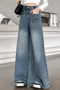 Person wearing wide-leg jeans in a casual setting
