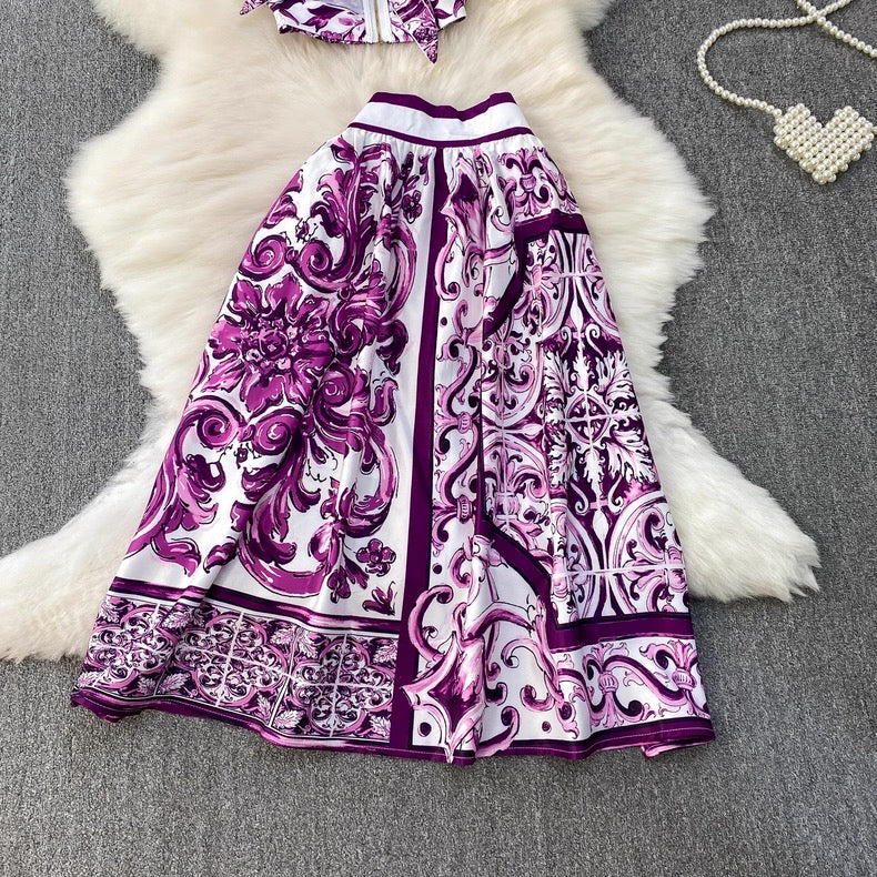 Purple and white patterned dress on a textured surface