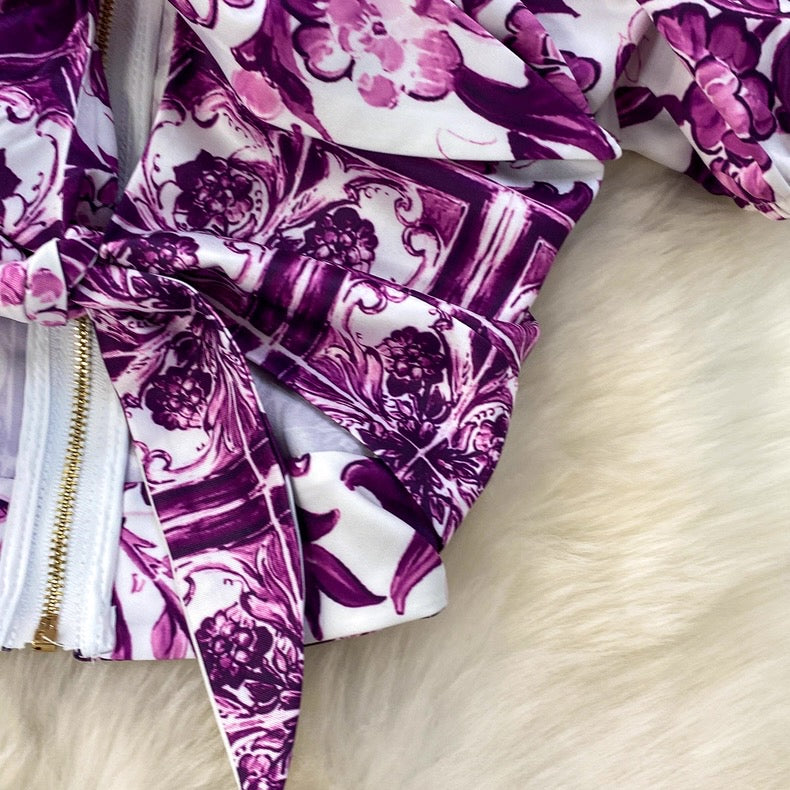 Purple and white patterned fabric on a wooden surface