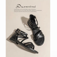 Black sandals with multiple straps on a beige background, featuring the brand 'Duowei'.
