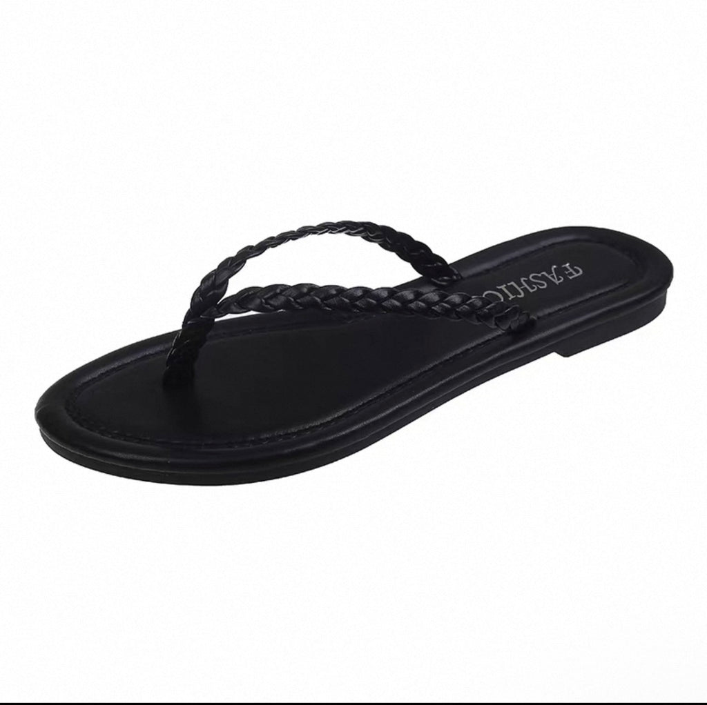 Black sandal with braided design on a white background