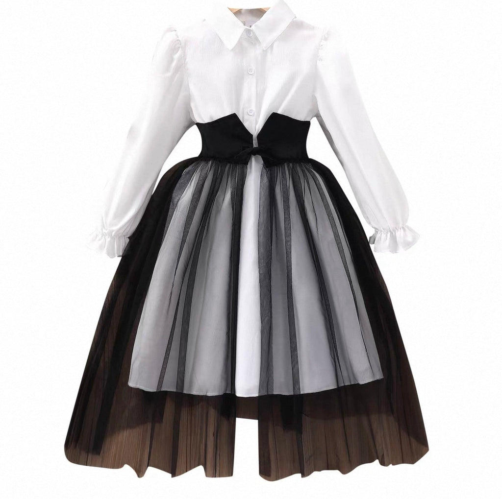 Dress with white shirt and black and white layered skirt on a white background