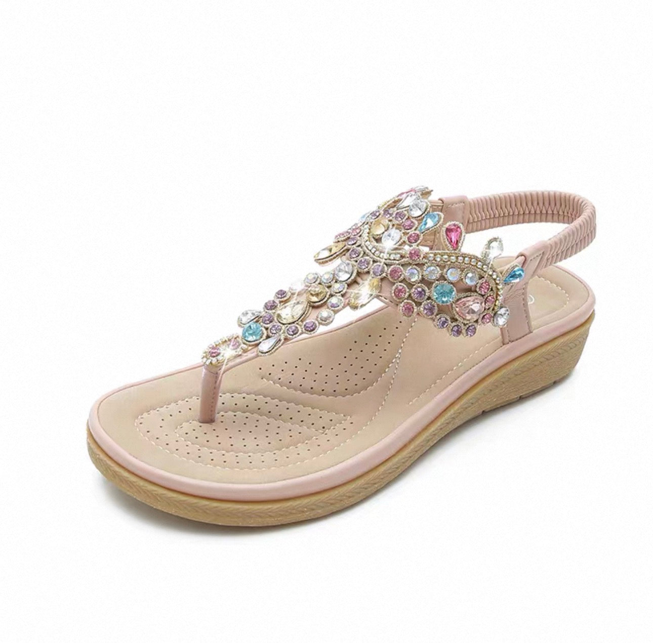 Beige sandal with colorful gemstones on a white background