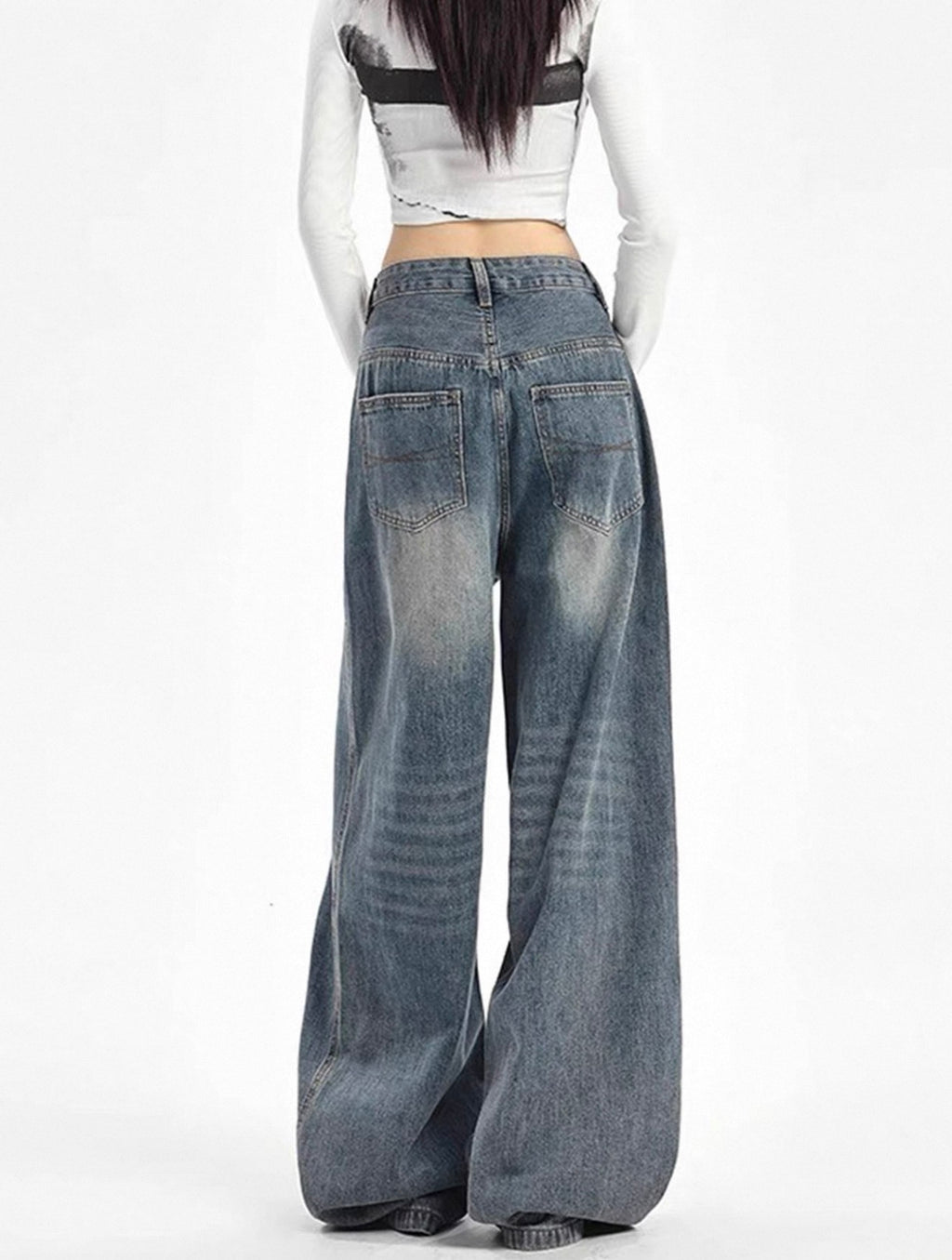 Wide-leg jeans worn by a model on a white background