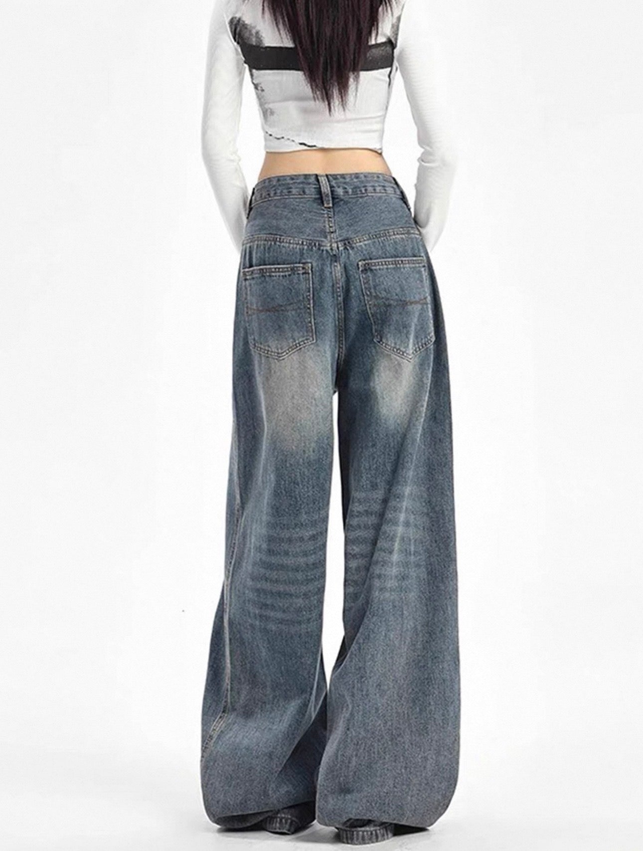 Wide-leg jeans worn by a model on a white background